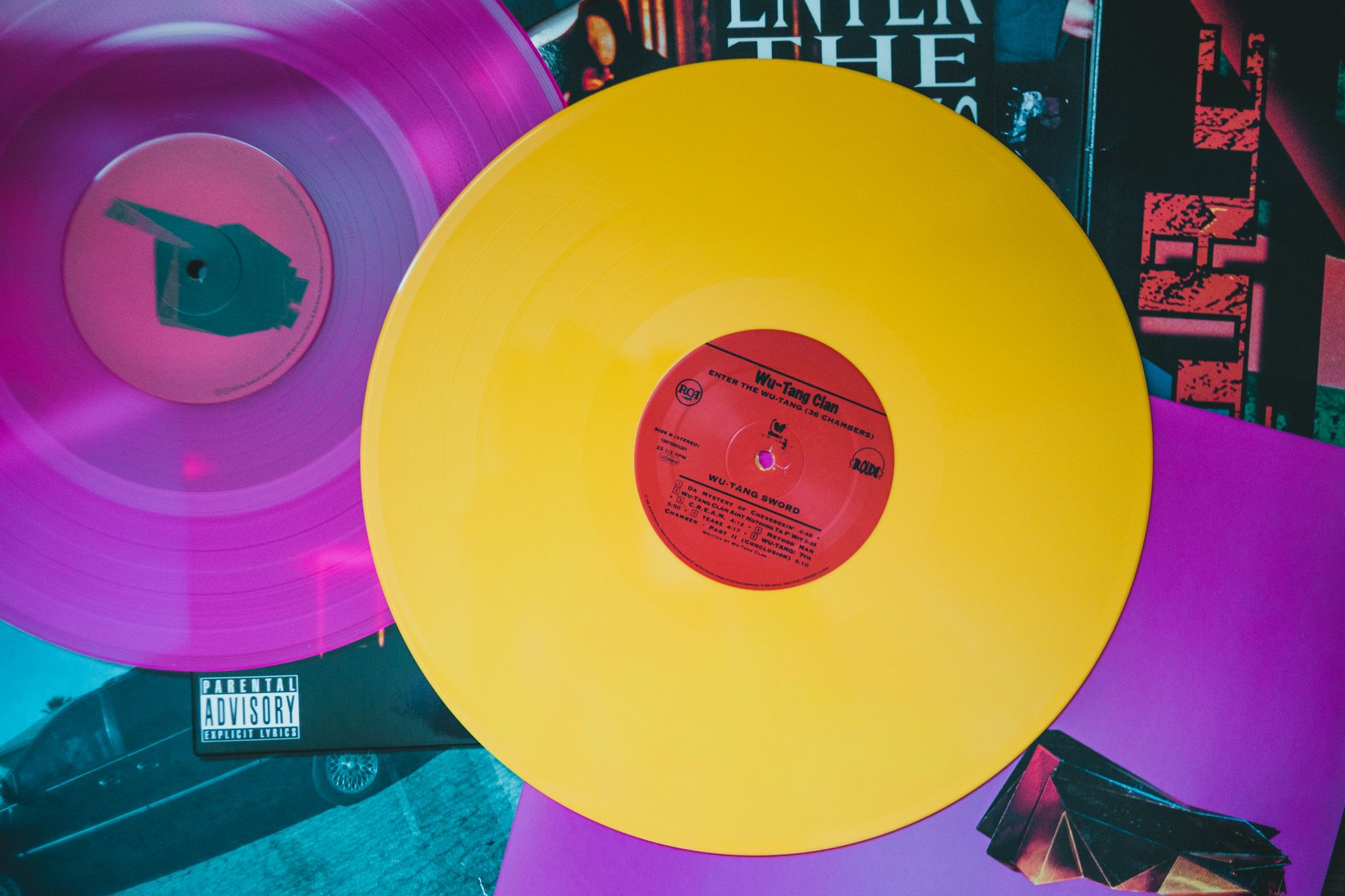 Rack of colored vinyl record variants in a record store