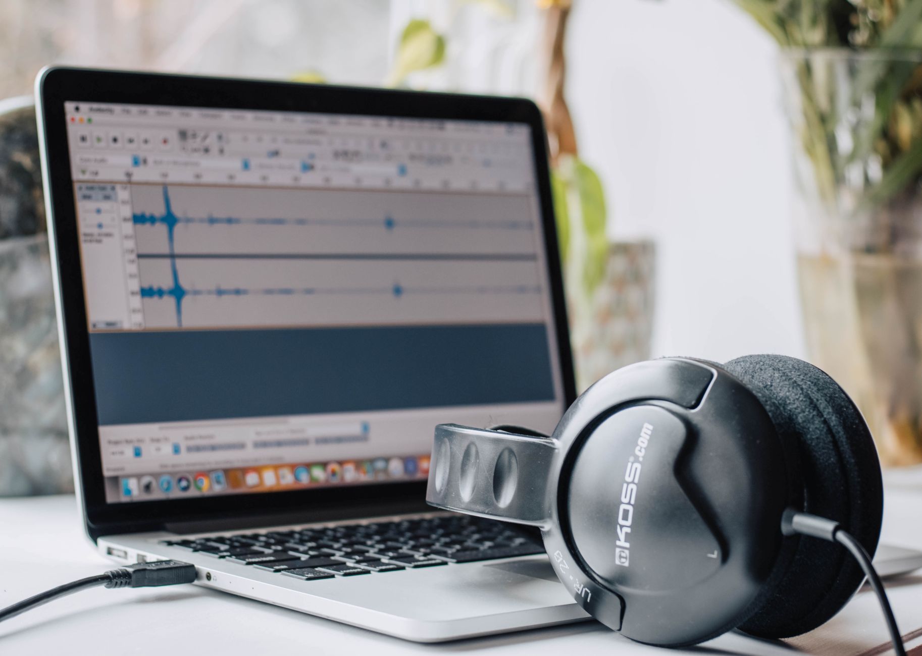 laptop and headphones used for music production