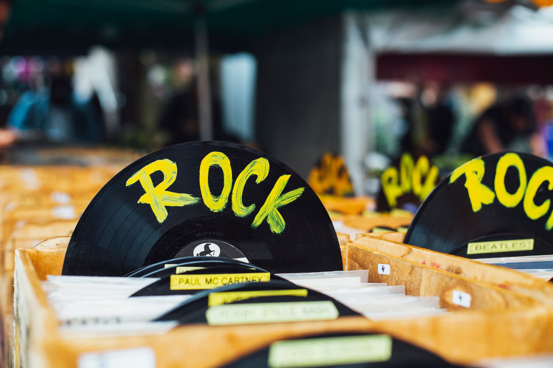 Producer flipping through vinyl records for a sample